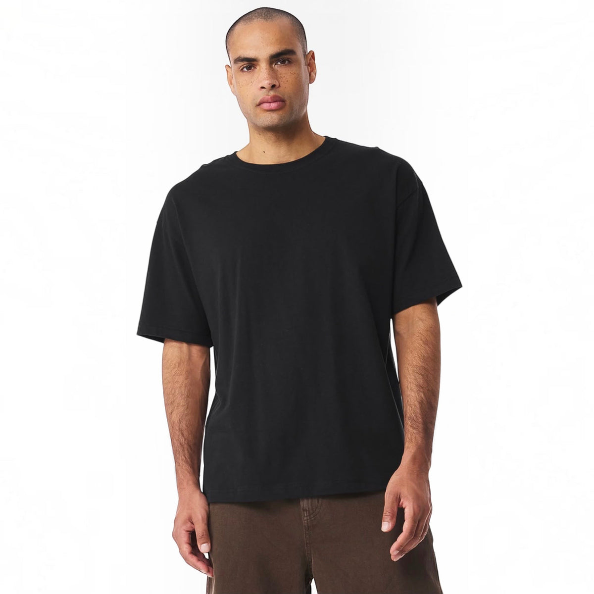 The Beauty Closet black crewneck t-shirt worn by a man with short hair, featuring a relaxed fit and cotton fabric.
