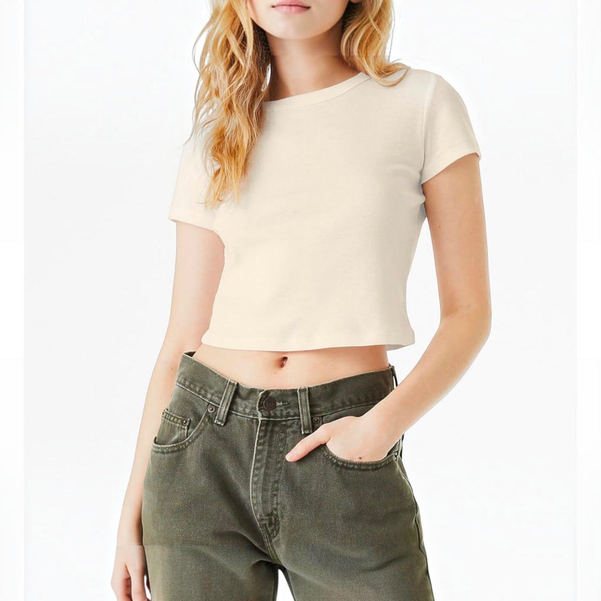 The Beauty Closet cream-colored cropped crewneck t-shirt worn by a woman with olive green jeans