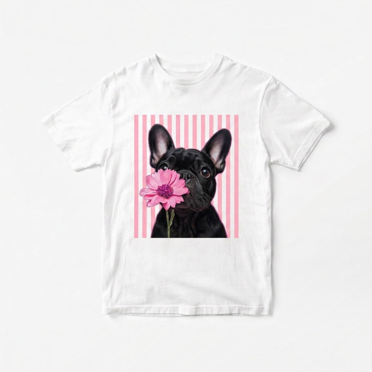 The Beauty Closet white cotton t-shirt featuring a graphic of a French Bulldog holding a pink flower on striped background