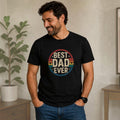 Man wearing a black The Beauty Closet t-shirt with a vintage Best Dad Ever graphic print in a circular design.