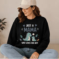 The Beauty Closet black crewneck sweatshirt featuring a cute dinosaur graphic with the text Just a Mama who loves her boy