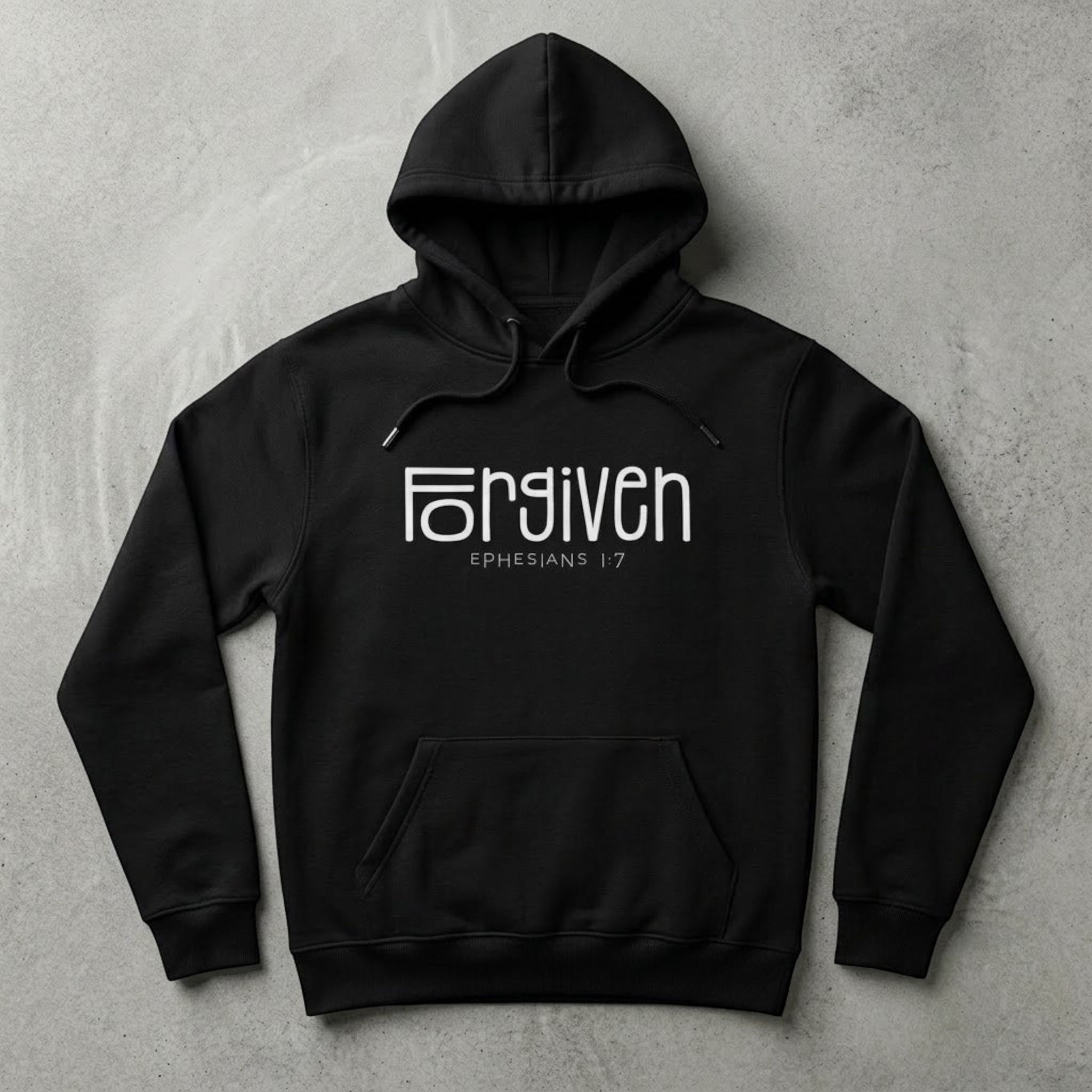 The Beauty Closet black pullover hoodie featuring white Forgiven Ephesians 1:7 graphic text and kangaroo pocket.