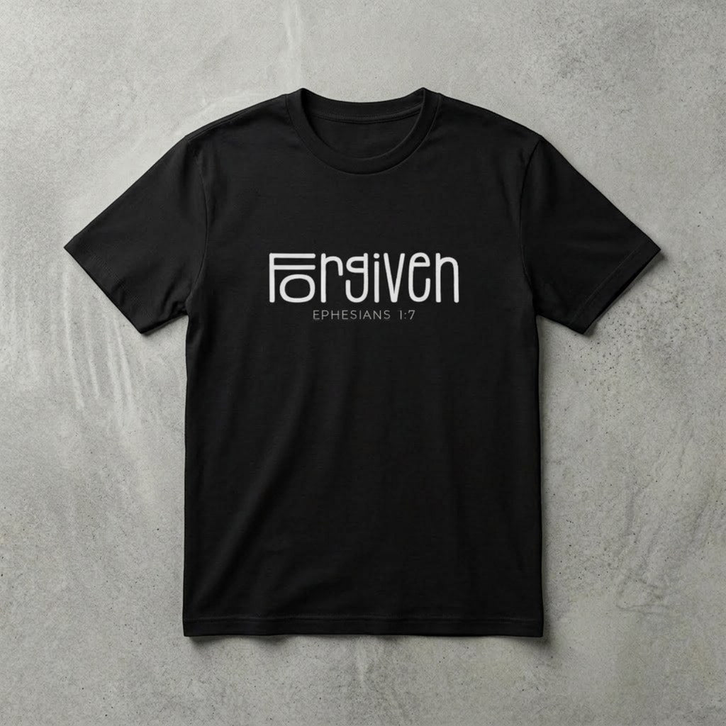 The Beauty Closet black cotton t-shirt featuring white Forgiven Ephesians 1:7 graphic text on a grey background.