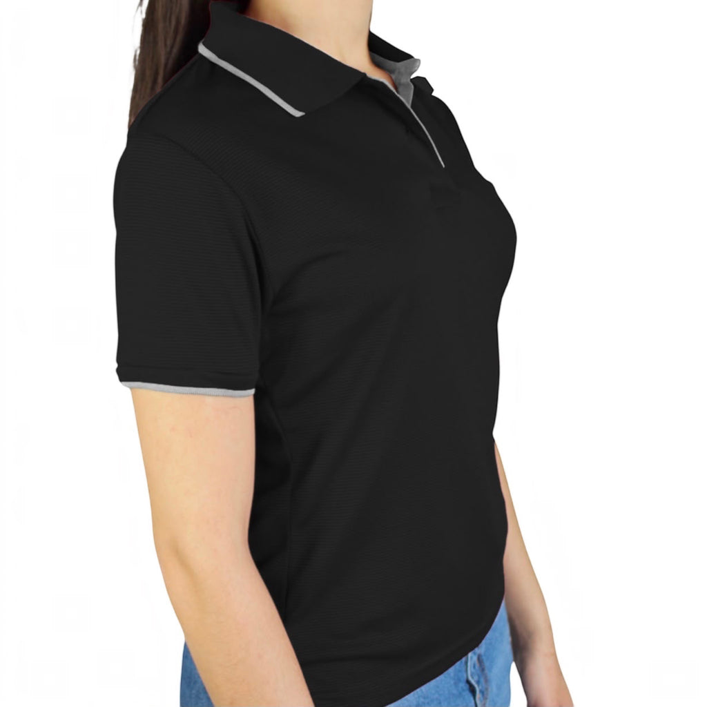 The Beauty Closet black short sleeve polo shirt with grey collar trim and ribbed cuffs worn by a woman