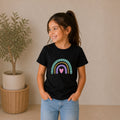 The Beauty Closet black cotton t-shirt for girls featuring a colorful rainbow and heart graphic print