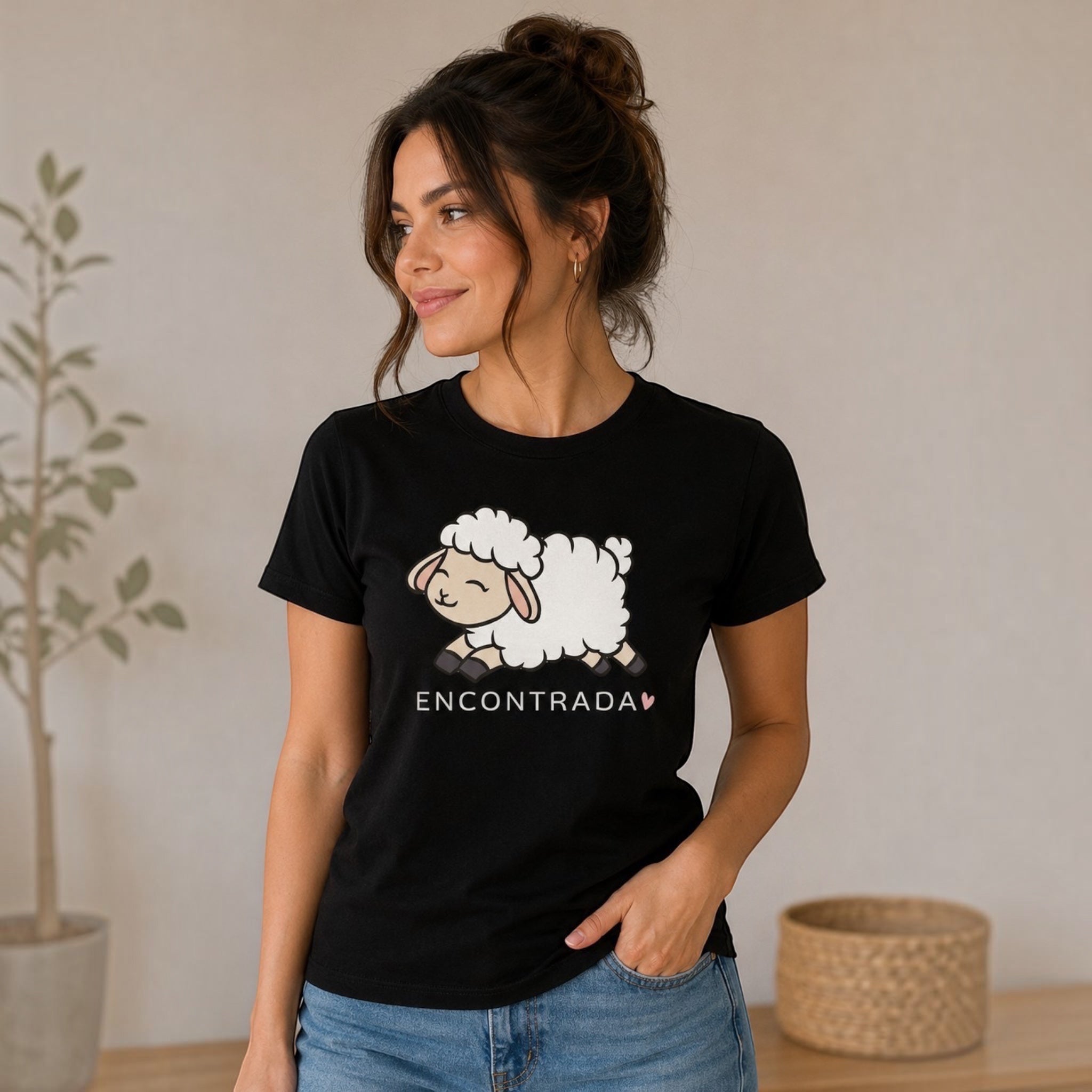 The Beauty Closet black t-shirt featuring a cute cartoon sheep graphic and the word ENCONTRADA with a small heart.