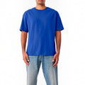 The Beauty Closet blue crewneck t-shirt worn by a man with light wash denim jeans
