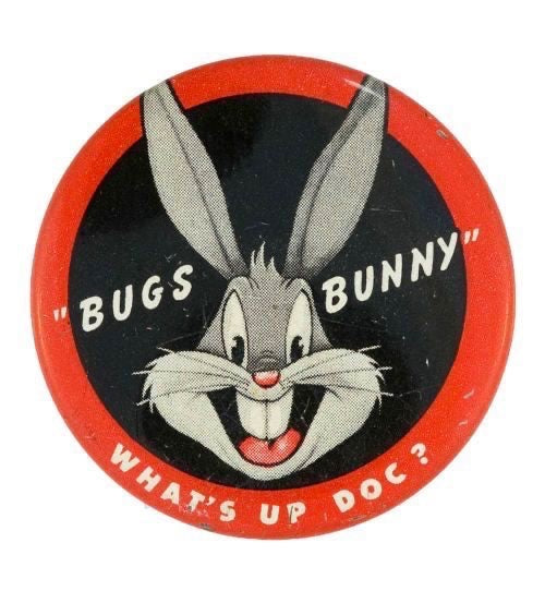 The Beauty Closet vintage Bugs Bunny circular pin badge with red border and What's Up Doc text