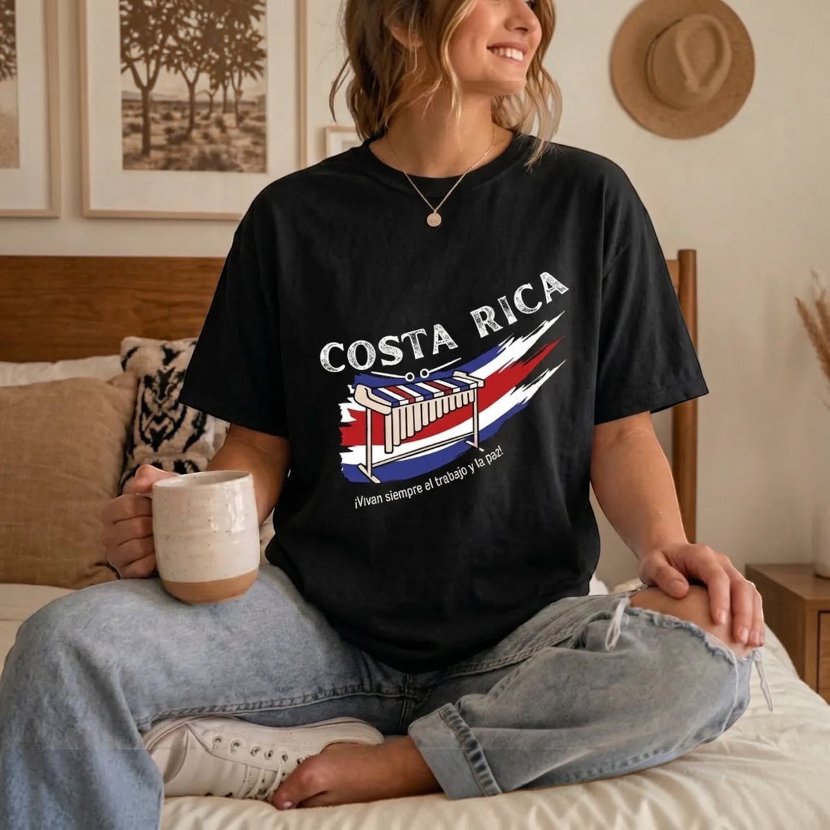 The Beauty Closet black cotton t-shirt featuring a Costa Rica graphic print with a marimba illustration