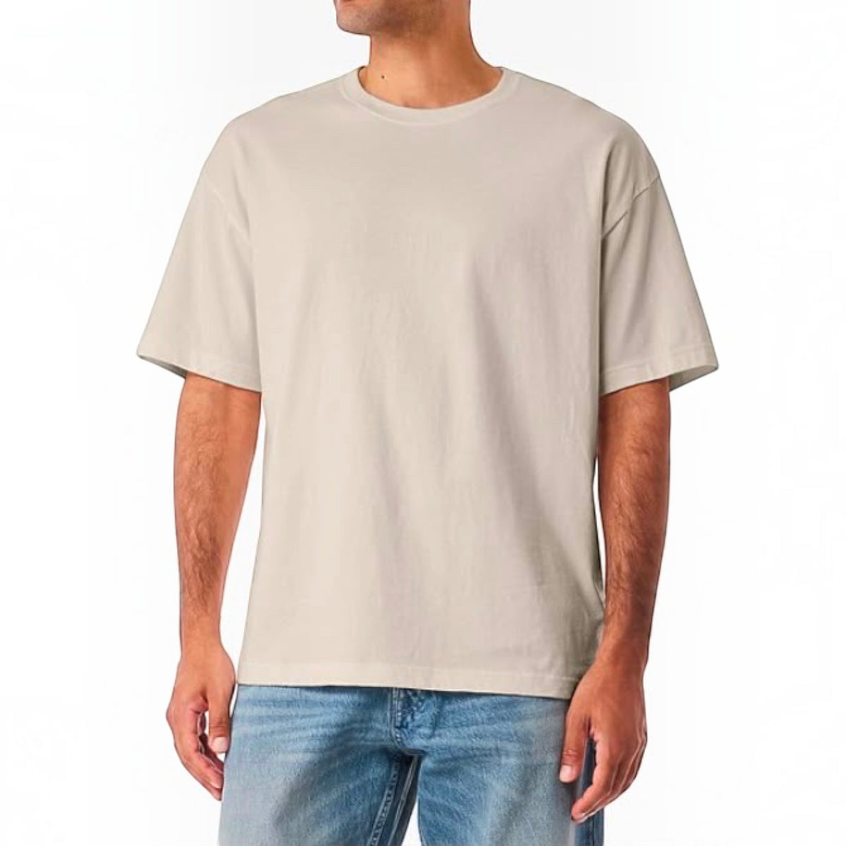The Beauty Closet cream cotton crewneck t-shirt with a relaxed fit worn by a man with blue denim jeans.