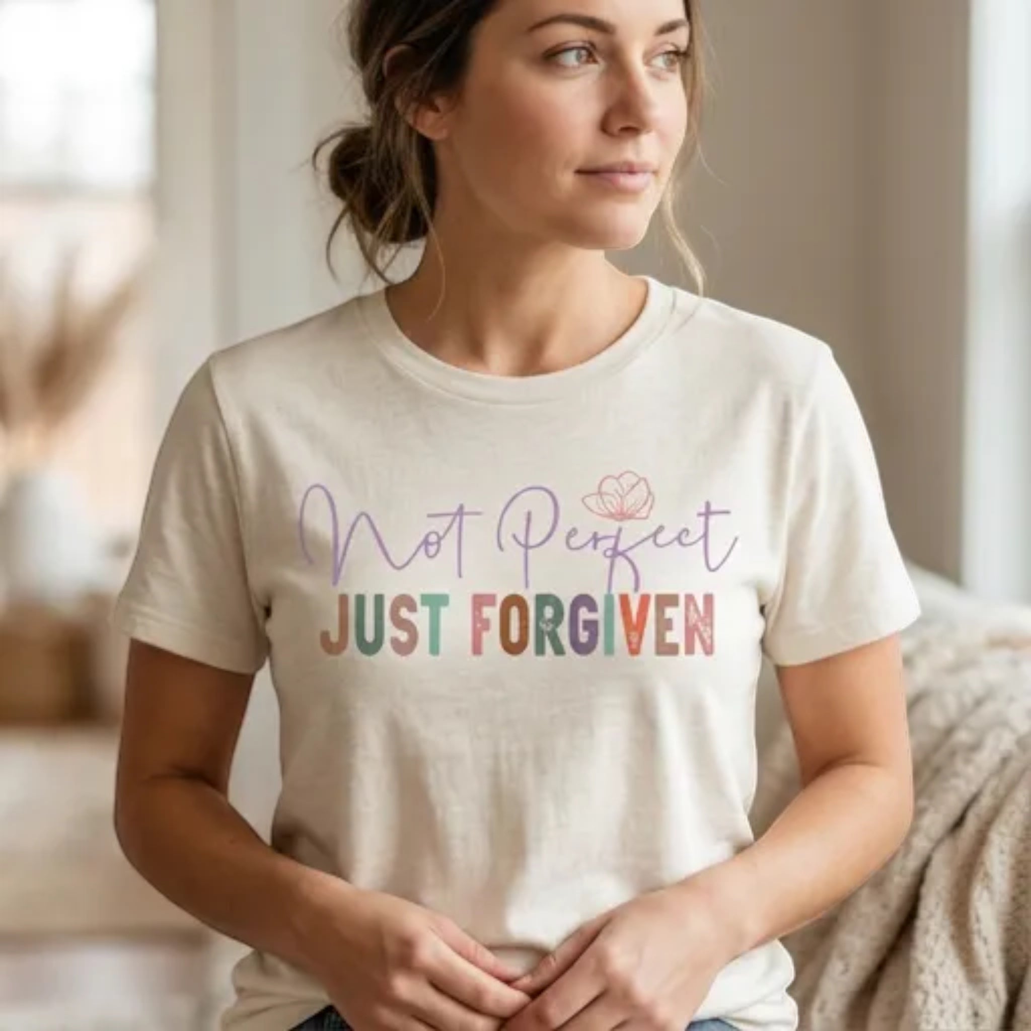 The Beauty Closet cream cotton crewneck t-shirt featuring Not Perfect Just Forgiven graphic print on a woman