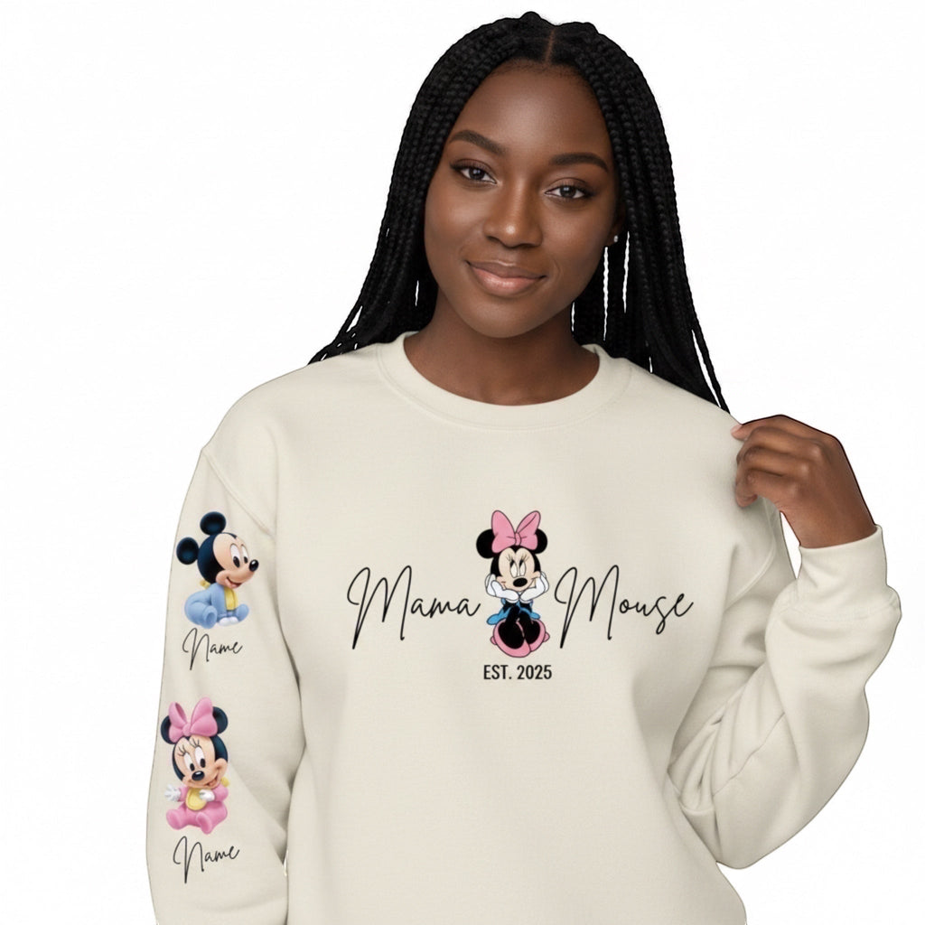 The Beauty Closet cream crewneck sweatshirt with Minnie Mouse Mama graphic and sleeve character prints on a model.