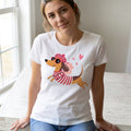 The Beauty Closet white cotton t-shirt featuring a cute dachshund in a beret and striped shirt with pink hearts.