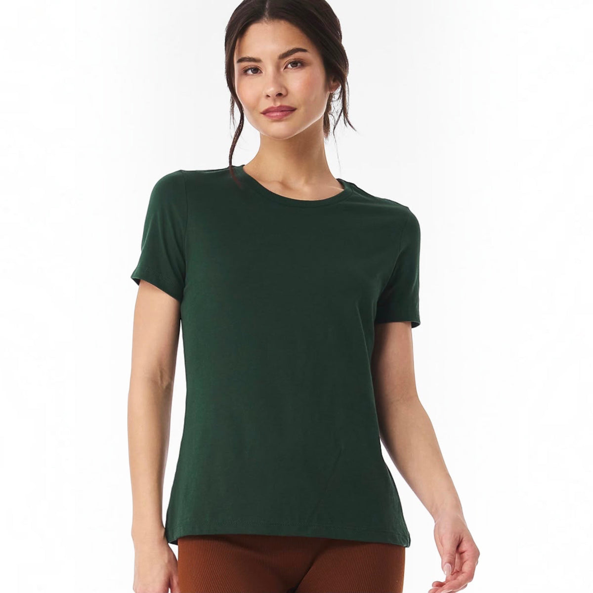 The Beauty Closet dark green cotton crewneck t-shirt worn by a woman against a white background