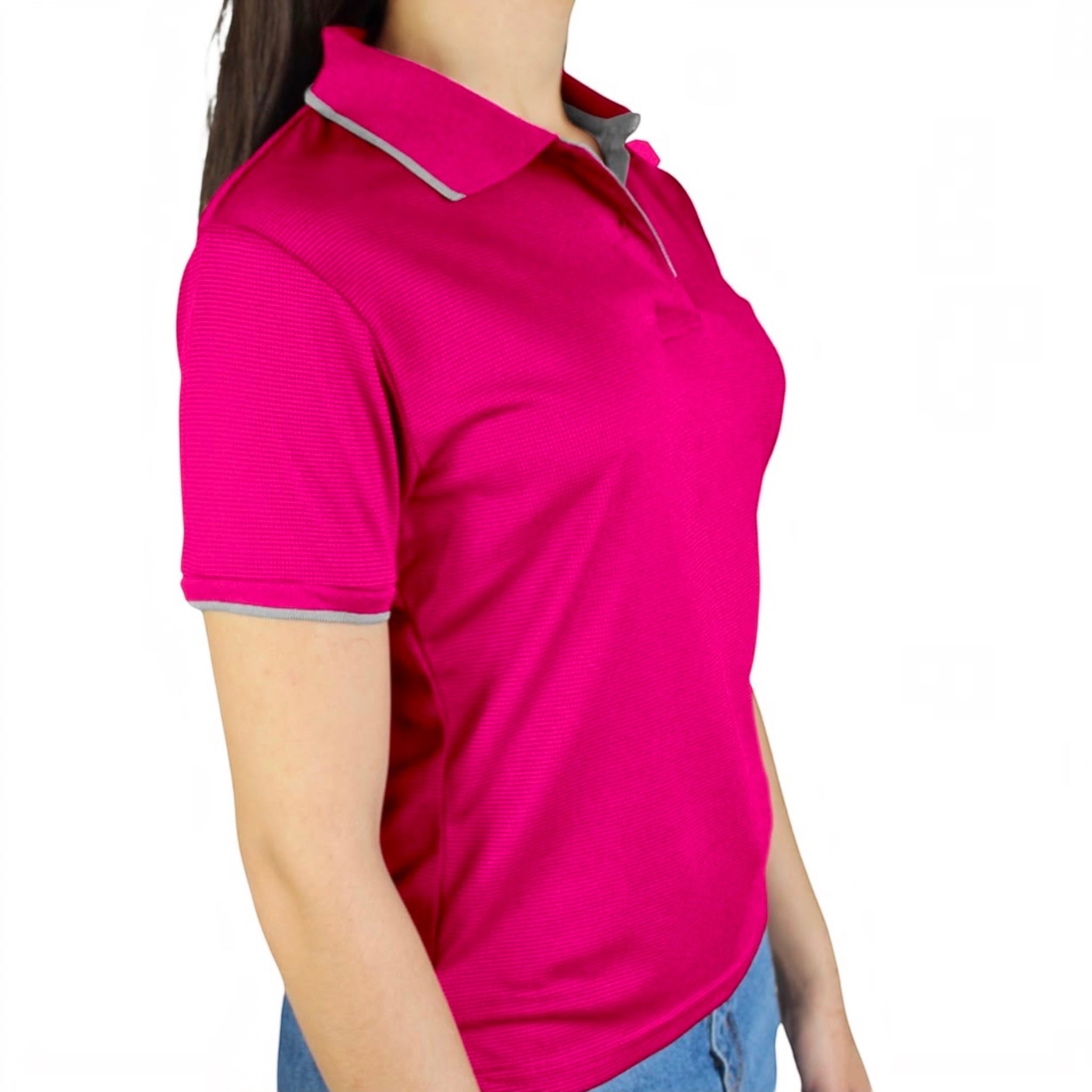 The Beauty Closet fuchsia pink short sleeve polo shirt with grey collar and cuff trim worn by a woman