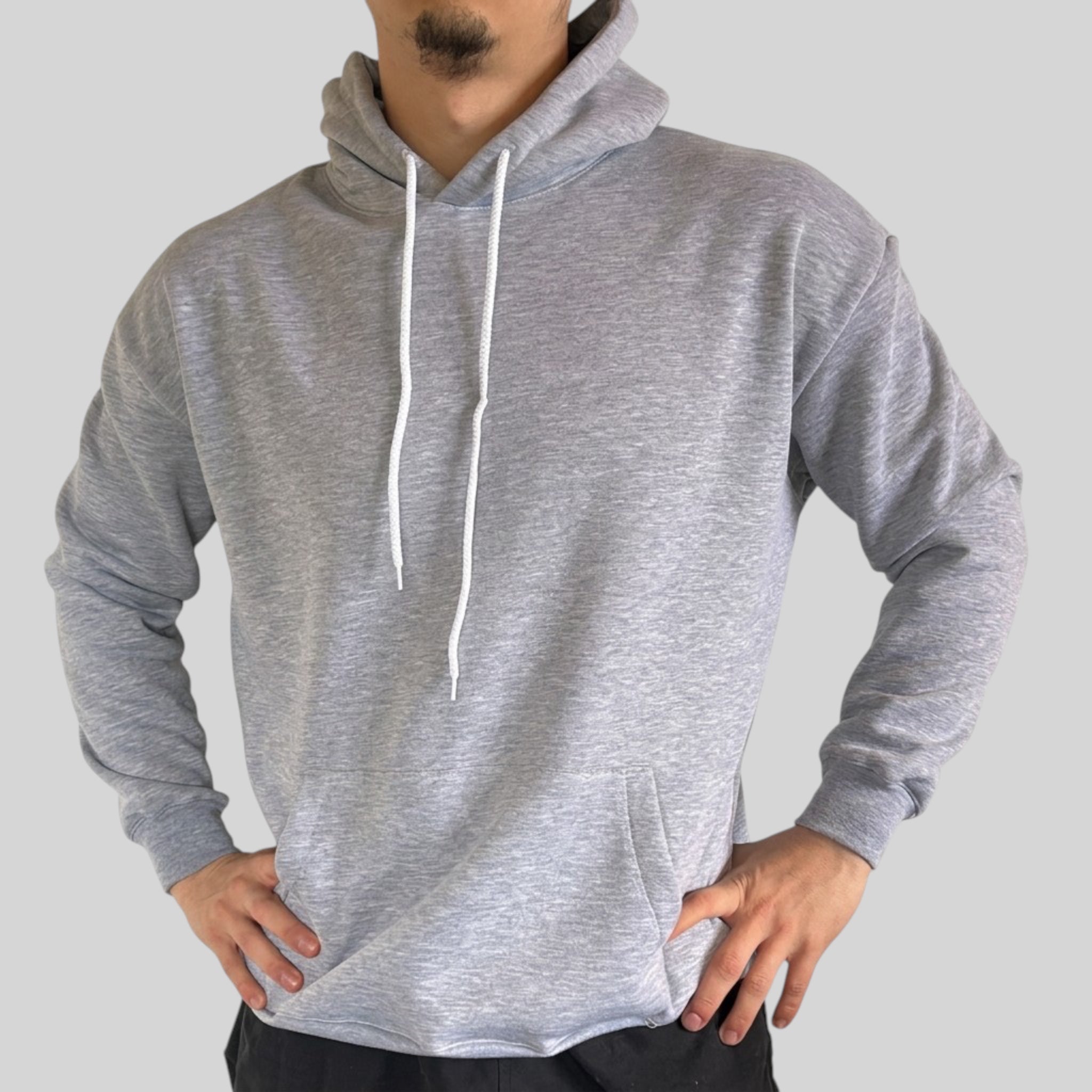 The Beauty Closet grey pullover hoodie with drawstring hood, kangaroo pocket, and ribbed cuffs on a male model.