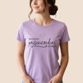 The Beauty Closet lavender short-sleeve crewneck t-shirt with floral graphic and Spanish typography print.