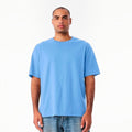 The Beauty Closet light blue crewneck t-shirt worn by a man, featuring a relaxed fit and soft cotton fabric.