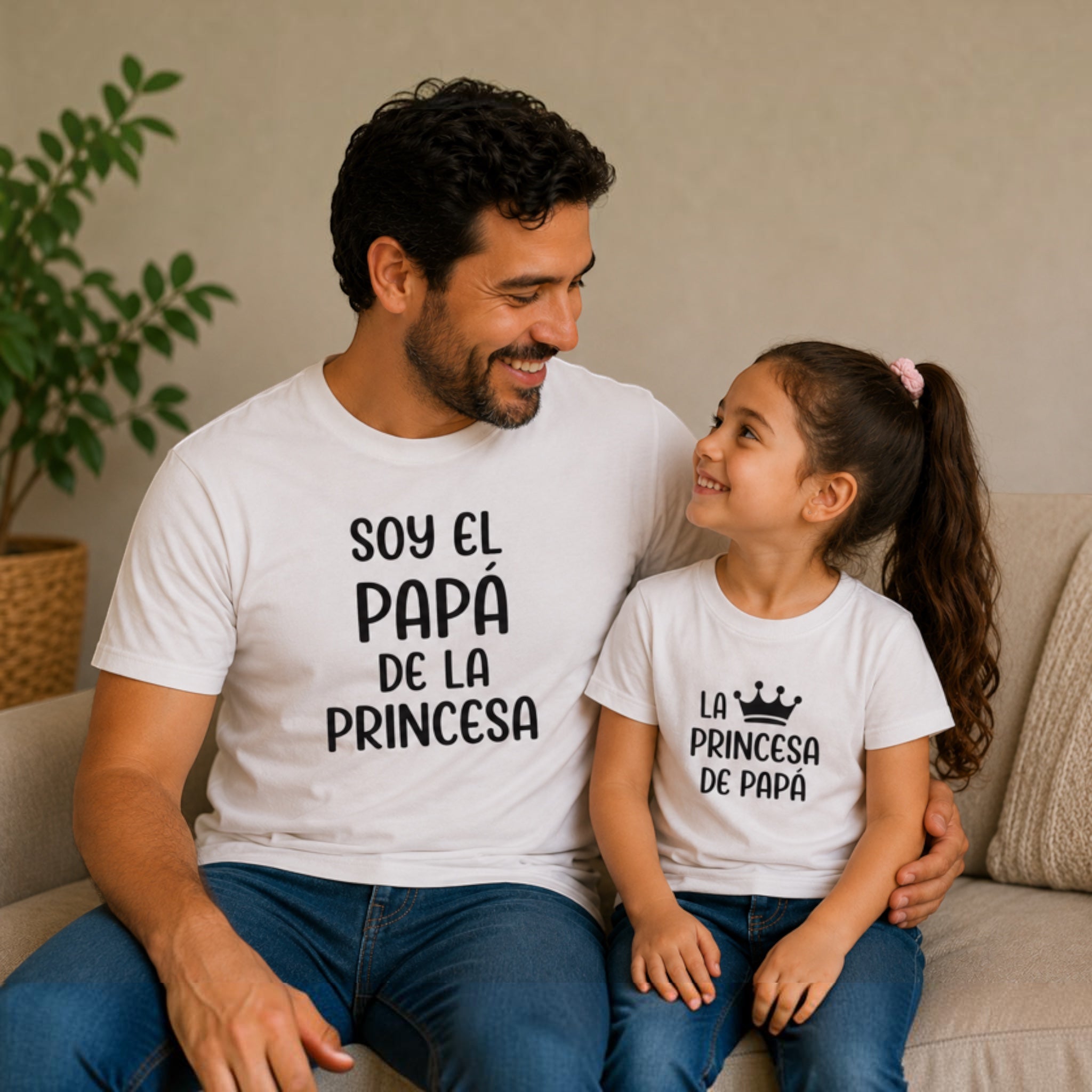 The Beauty Closet matching white cotton t-shirts for father and daughter with Spanish text and crown graphic