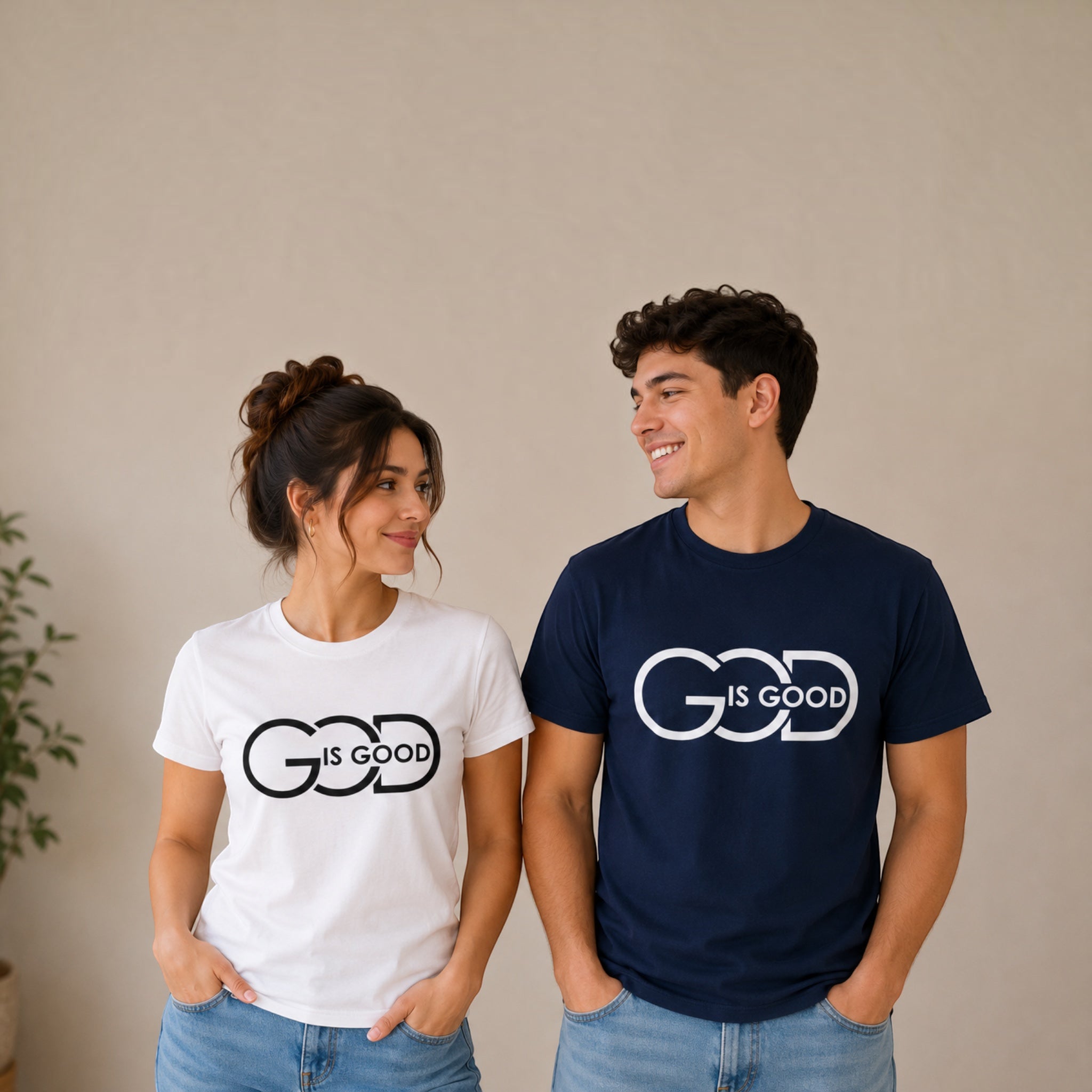 The Beauty Closet couple wearing matching white and navy blue cotton t-shirts with God Is Good graphic print