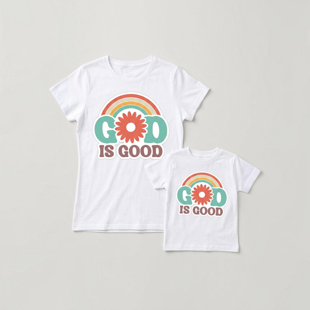 The Beauty Closet white matching t-shirts for parent and child featuring a retro God Is Good rainbow and flower graphic.