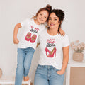 The Beauty Closet matching white graphic t-shirts for mother and daughter with red shoe prints and Spanish text
