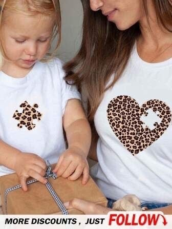 The Beauty Closet matching white t-shirts for mom and child with leopard print heart and puzzle piece designs