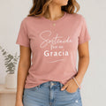 The Beauty Closet mauve t-shirt with white "Sostenida por su Gracia" text graphic. Short sleeves, crew neck, relaxed fit.