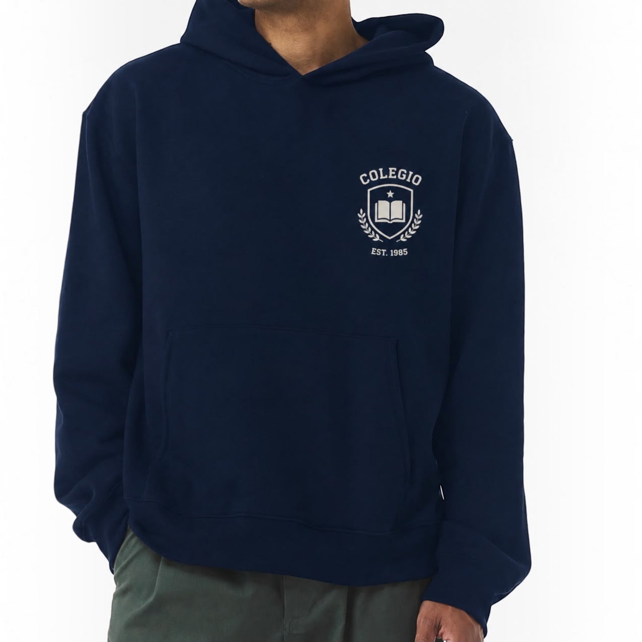 The Beauty Closet navy blue unisex fleece hoodie with a white Colegio 1985 crest graphic on the chest.