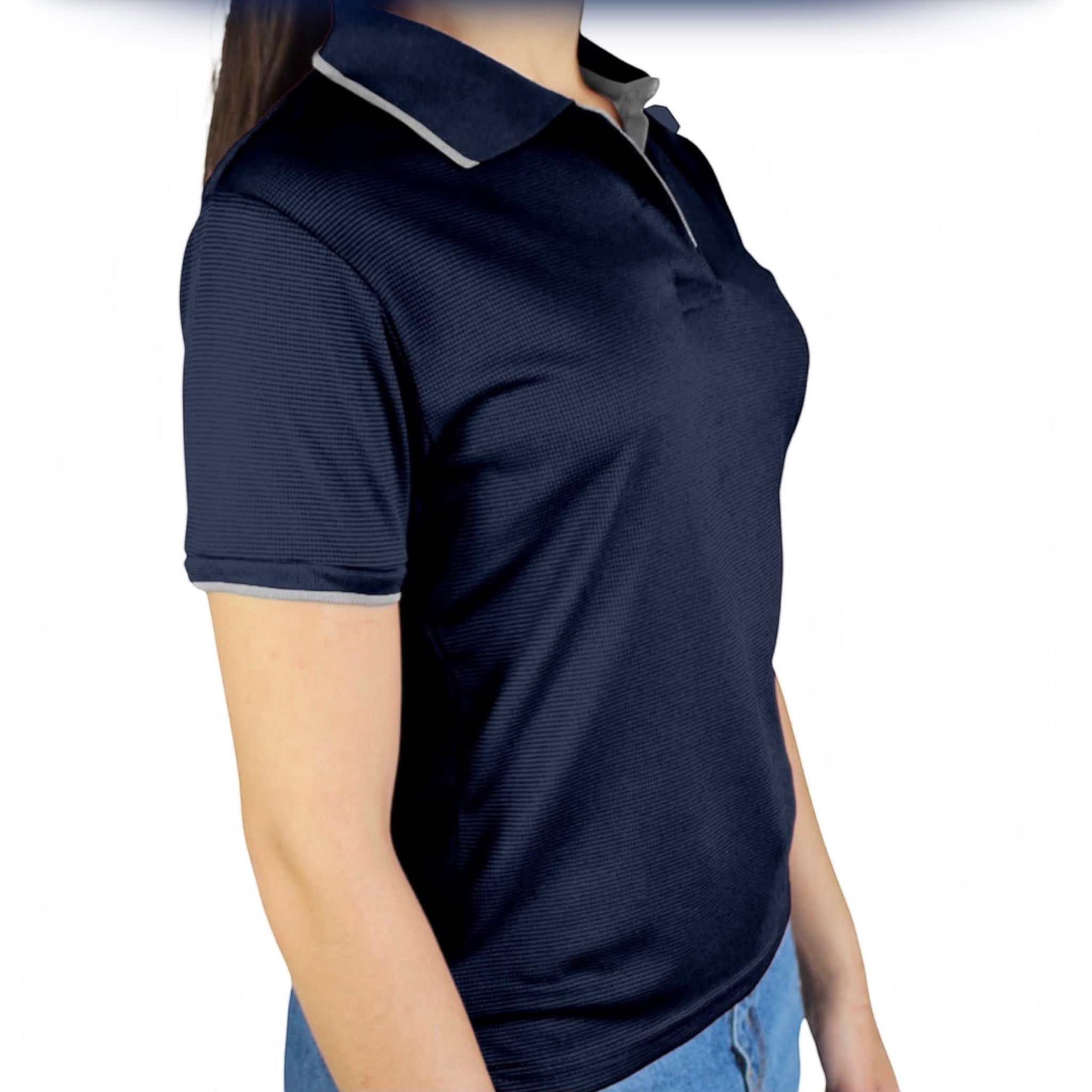 The Beauty Closet navy blue short sleeve polo shirt with grey collar trim and textured fabric on a model