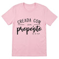 The Beauty Closet light pink crewneck t-shirt featuring the black text Creada con un propósito ef 2:10