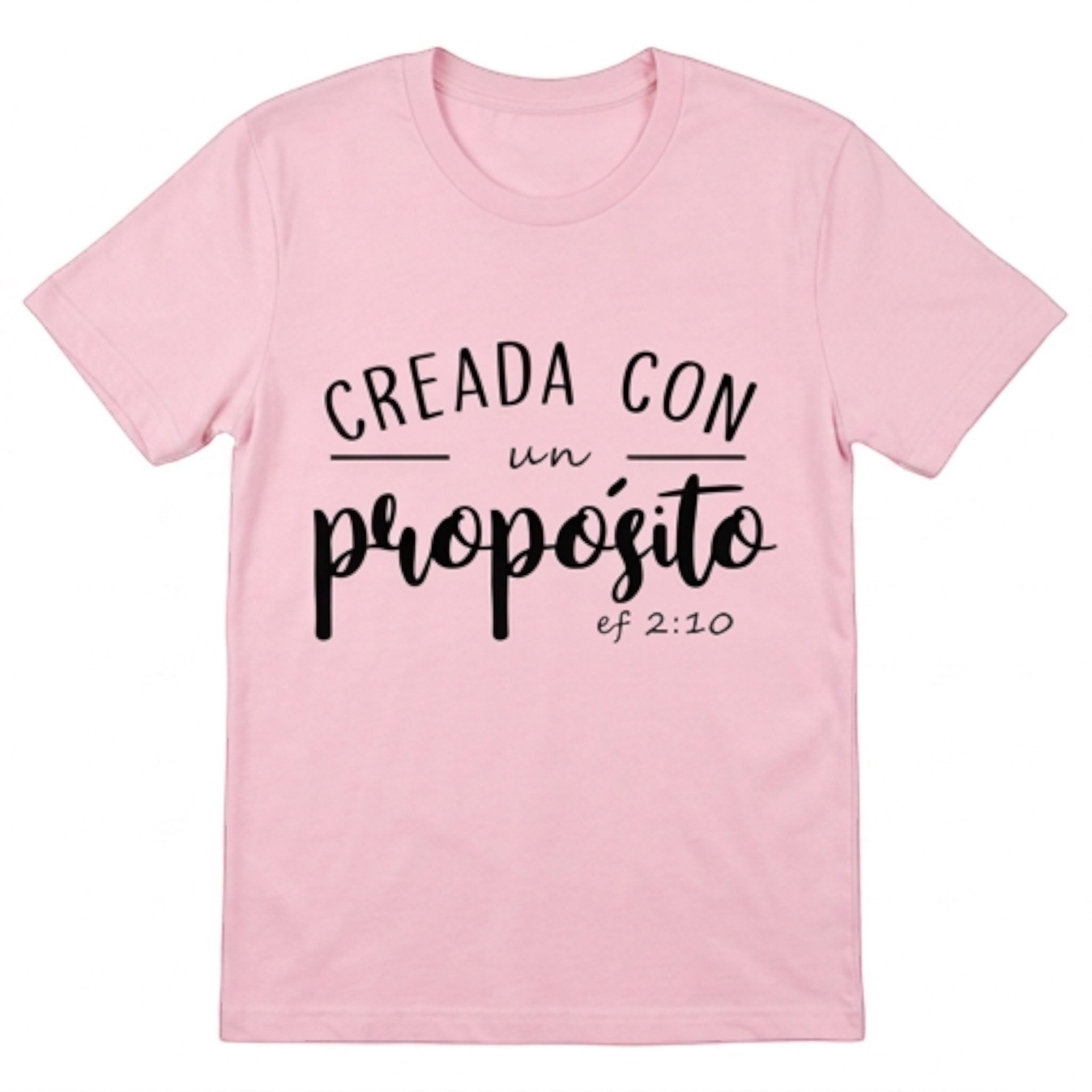 The Beauty Closet light pink crewneck t-shirt featuring the black text Creada con un propósito ef 2:10