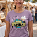 The Beauty Closet heather purple crewneck t-shirt featuring a Mejor Abuela del Mundo graphic with a crown illustration.
