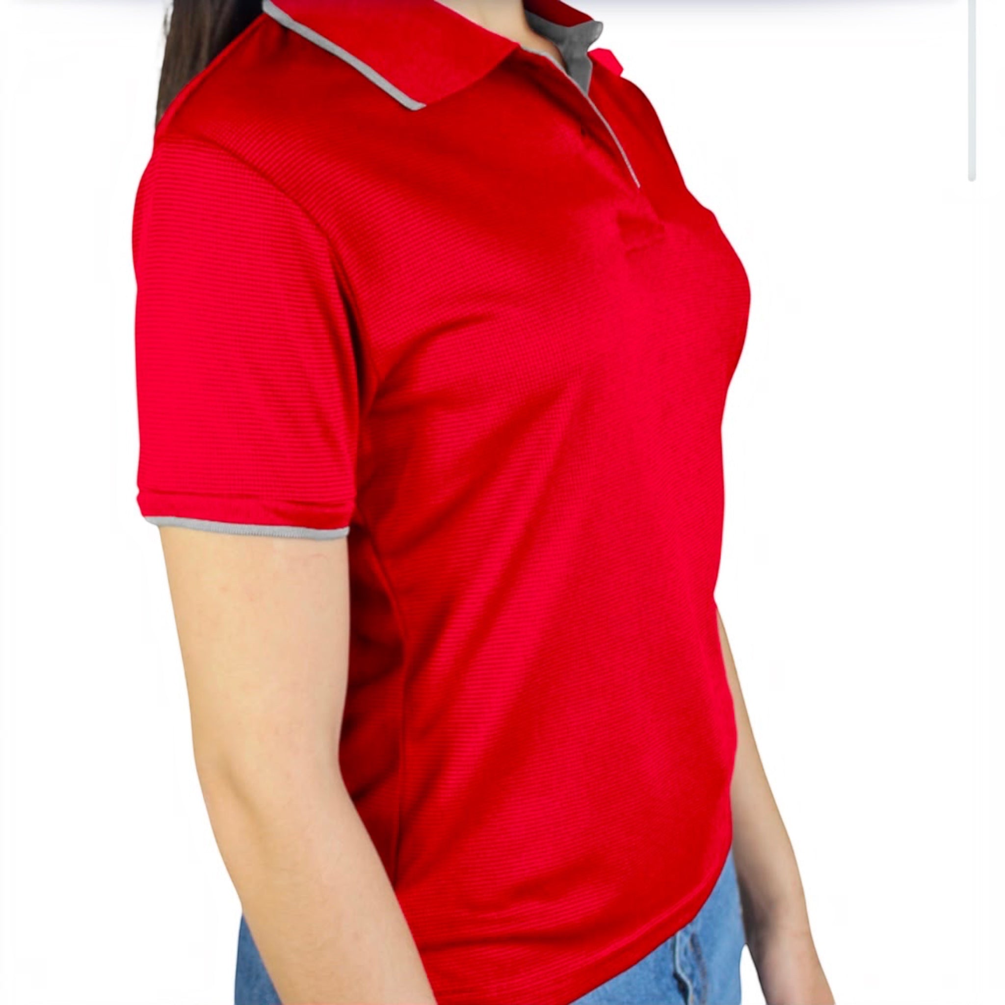The Beauty Closet red short sleeve polo shirt with grey collar and cuff trim worn by a woman with blue jeans
