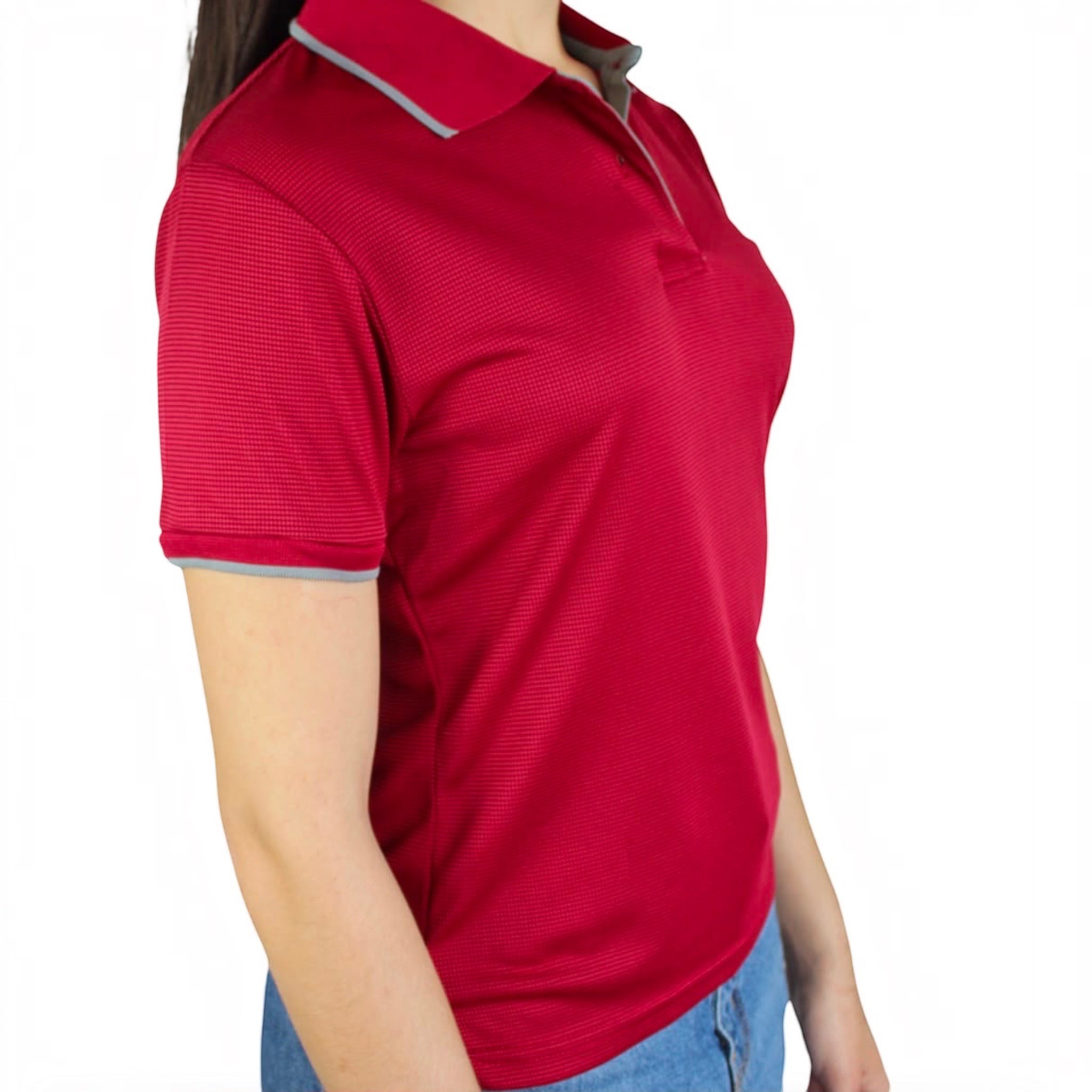 The Beauty Closet red short sleeve polo shirt with grey collar and cuff trim worn by a woman with blue jeans