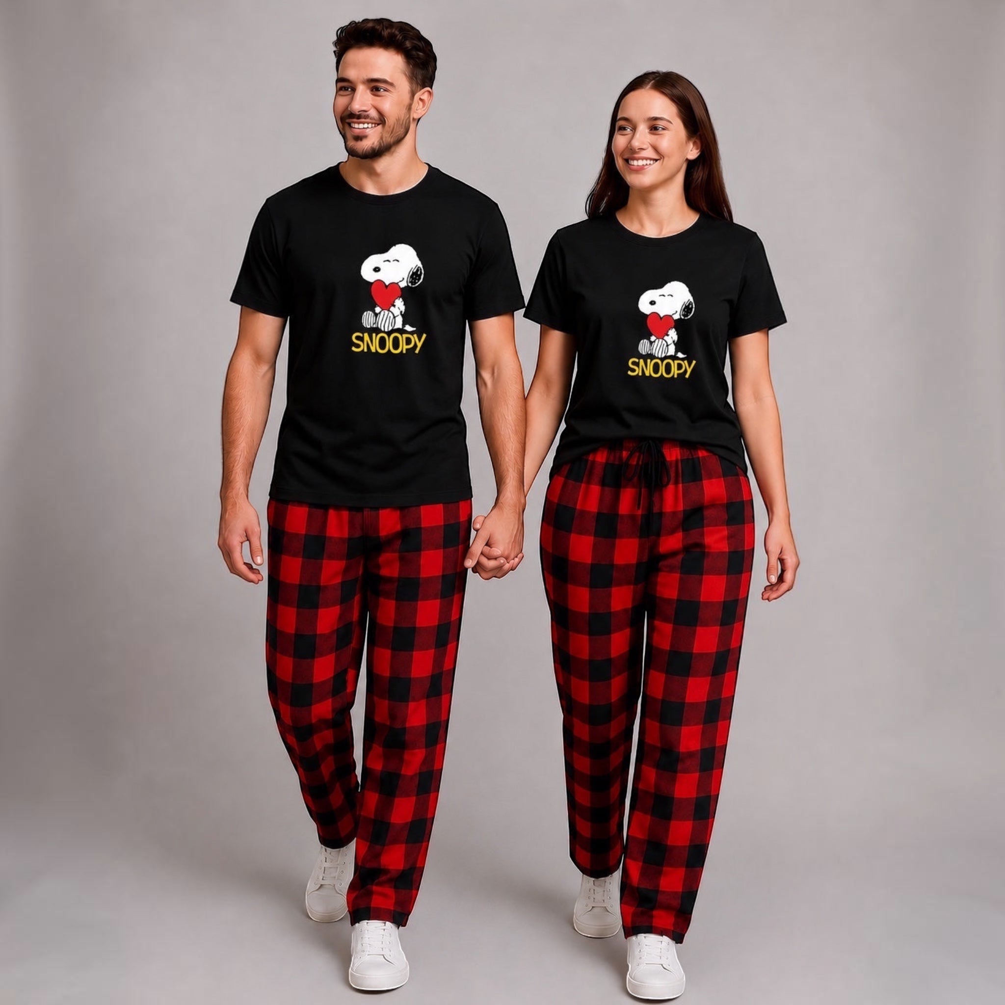 The Beauty Closet black Snoopy graphic t-shirt with red heart and plaid pajama pants.