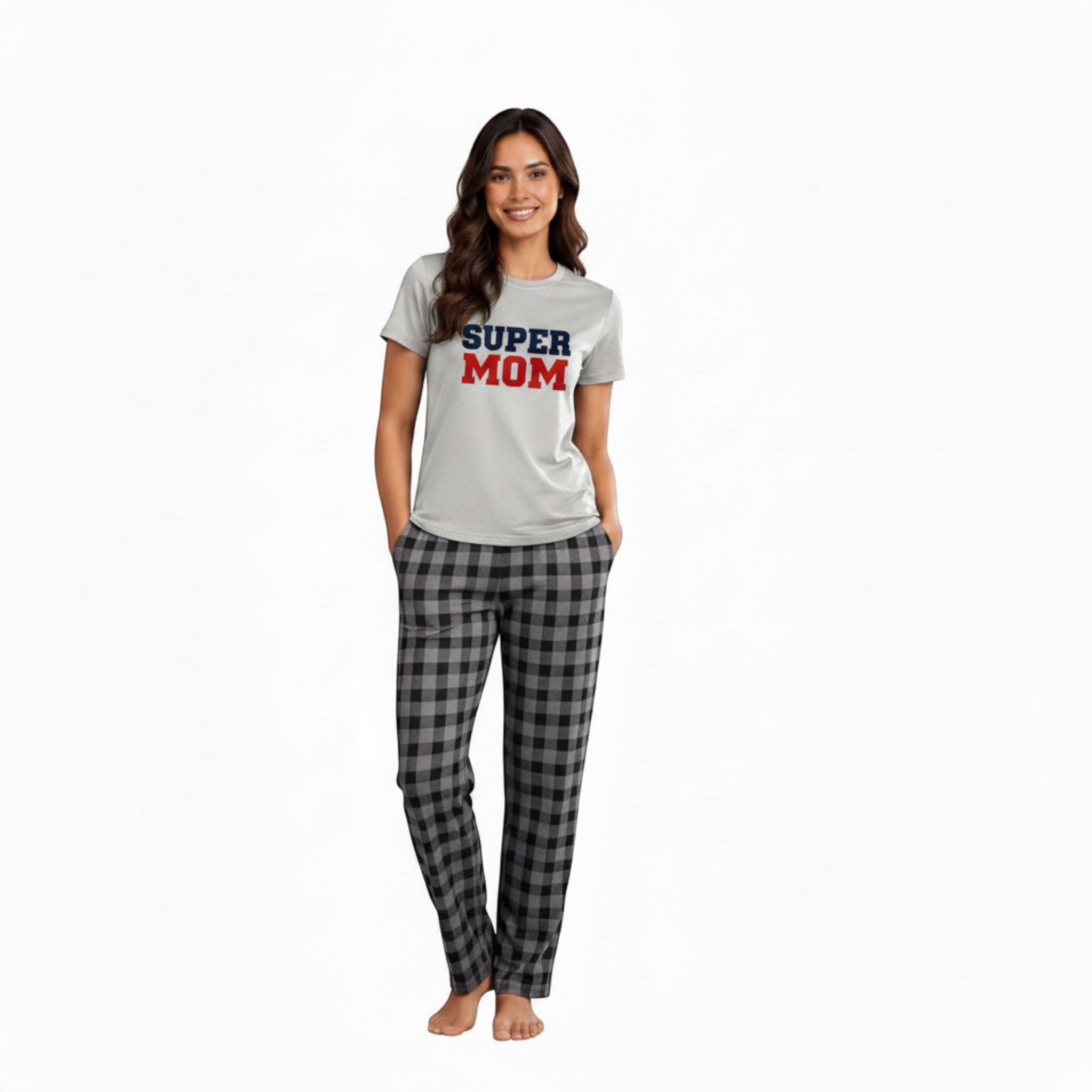 The Beauty Closet Super Mom graphic t-shirt worn by a smiling woman with grey plaid pajama pants.