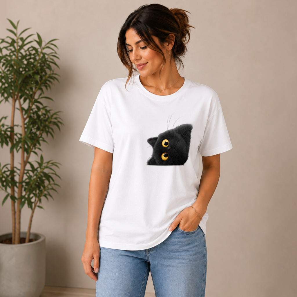 The Beauty Closet white cotton t-shirt with a playful black cat graphic peeking from the side. Relaxed fit, crew neck.
