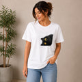 The Beauty Closet white cotton t-shirt with a playful black cat graphic peeking from the side. Relaxed fit, crew neck.