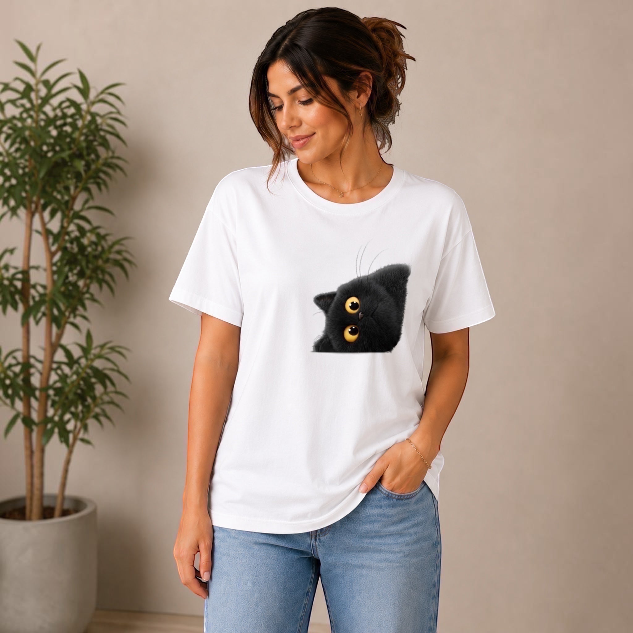 The Beauty Closet white cotton t-shirt with a playful black cat graphic peeking from the side. Relaxed fit, crew neck.