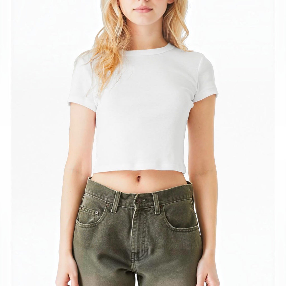 The Beauty Closet white cotton crewneck crop top worn by a woman with blonde hair paired with olive green jeans