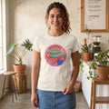 The Beauty Closet white cotton crewneck t-shirt featuring a playful sardine and kitten graphic print on a woman.