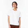 The Beauty Closet white crewneck cotton t-shirt worn by a woman with a relaxed fit for casual everyday wear