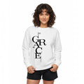 The Beauty Closet white crewneck sweatshirt with black Grace typography print worn by a woman with curly hair.