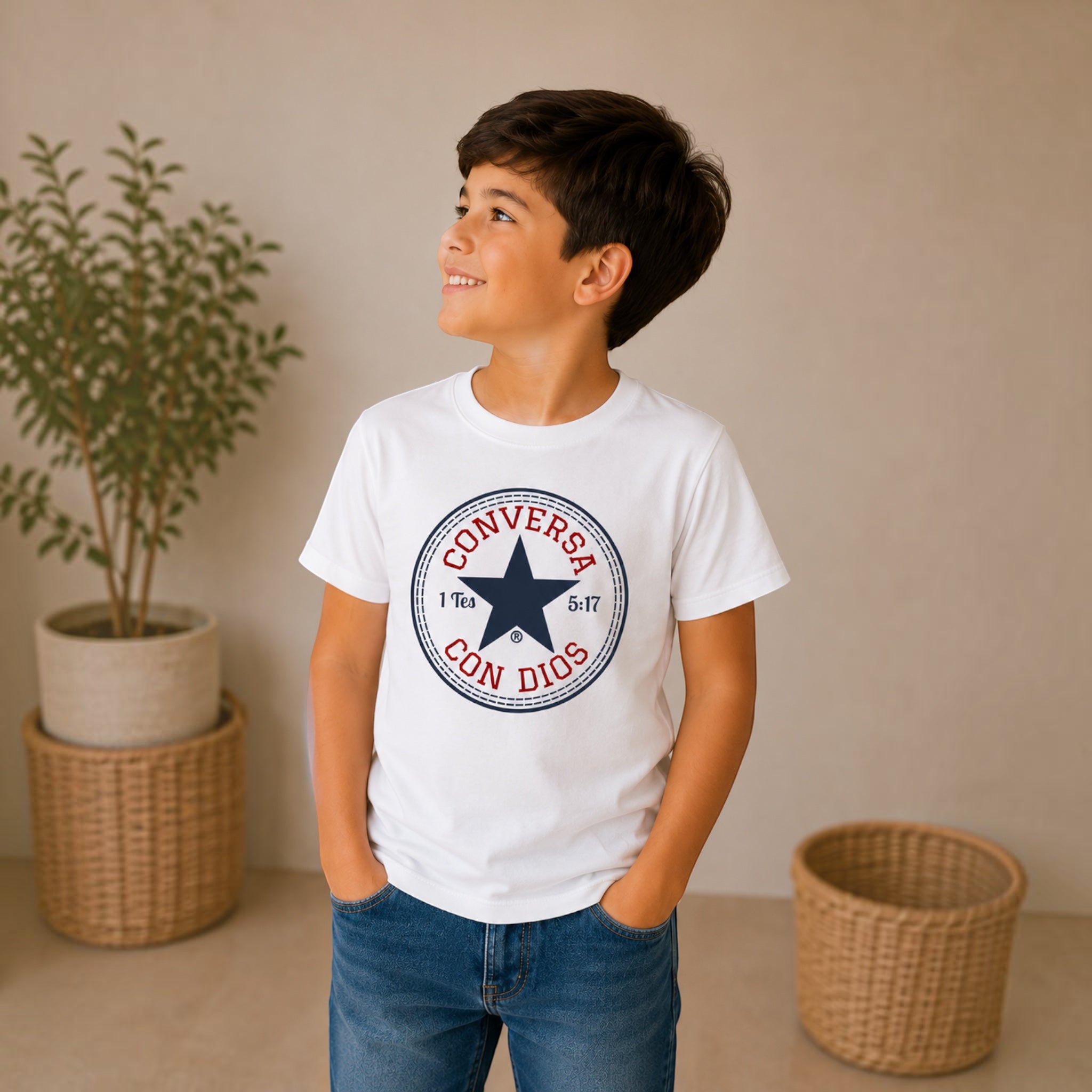 The Beauty Closet white cotton t-shirt with Conversa Con Dios graphic print worn by a smiling boy