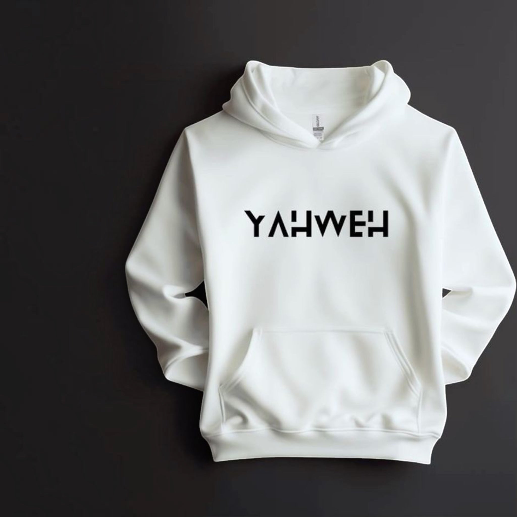 The Beauty Closet white hoodie featuring the word YAHWEH in bold black lettering on the chest with a front pocket.
